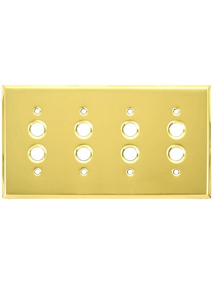 Classic Four Gang Push Button Switch Plate In Polished Brass Finish.